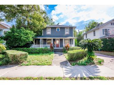 Charming two-story home with a well-maintained front yard and inviting porch at 520 E Anderson St, Orlando, FL 32801