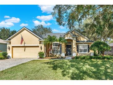 Charming single-Gathering home with a well-manicured lawn and inviting front entrance at 873 Gulf Land Dr, Apopka, FL 32712