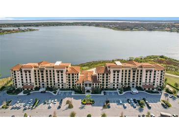 A beautiful condo complex is set against a backdrop of serene lakefront property at 16300 County Road 455 # 712, Montverde, FL 34756