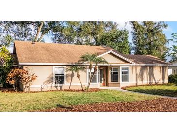 Charming single-story home with well-maintained lawn and mature landscaping at 1801 Chamberlin St, Orlando, FL 32806