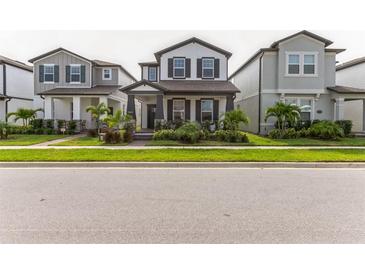 Charming two-story home with well-maintained lawn and landscaping in a modern community at 13819 Lanyard Way, Winter Garden, FL 34787