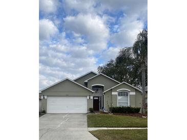 Charming single-Gathering home with manicured front yard and attached two-car garage at 2121 Falkner Rd, Maitland, FL 32751