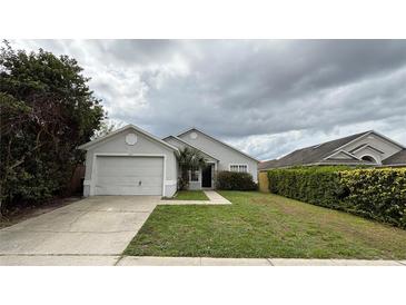 Charming single-Gathering home featuring a well-maintained lawn and attached two-car garage at 458 Lancers Dr, Winter Springs, FL 32708