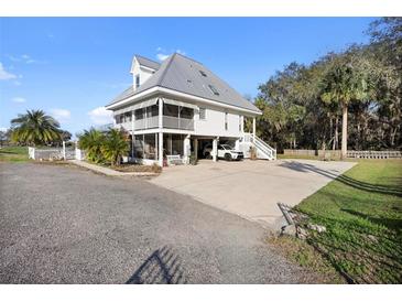 Stunning raised beach house with metal roof, screened porch, and ample parking space at 2045 Green Cedar Ln, Geneva, FL 32732