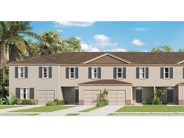 Charming two-story townhome with landscaped yard and attached garages at 3368 Private Oak Dr, Apopka, FL 32703
