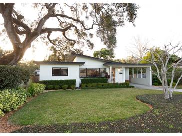 Charming single-story home with well-manicured lawn and mature landscaping at 12 S Lawsona Blvd, Orlando, FL 32801