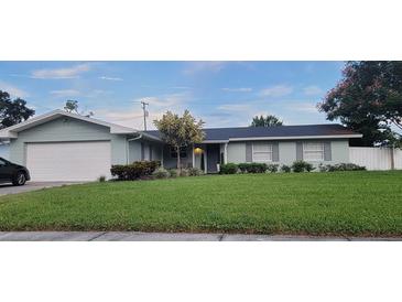 Charming single-story home with well-maintained lawn and attached one car garage at 3807 March Ave, Orlando, FL 32806