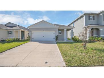 Charming one story home with a well manicured lawn and long driveway at 863 August Sky Dr, Deltona, FL 32738