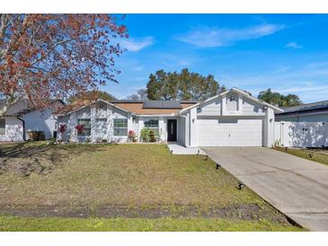 Charming single-Gathering home with a well-maintained lawn and a two-car garage at 211 Dalton Dr, Kissimmee, FL 34758