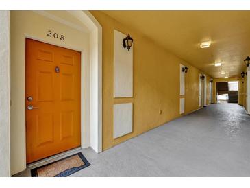 Condo hallway with door number 208, modern lighting, and freshly painted walls at 3338 Robert Trent Jones Dr # 20804, Orlando, FL 32835