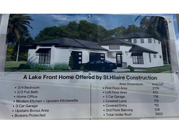 New construction lakefront home featuring a three car garage and modern design at 336 Caladium Ave, Lake Alfred, FL 33850