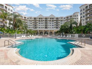 Take a dip in the sparkling blue pool surrounded by lush landscaping and a resort-style setting at 1 John Anderson Dr # 317, Ormond Beach, FL 32176