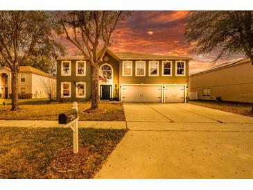 Charming two-story home with a well-manicured lawn, three-car garage, and beautiful curb appeal at 1262 Stonewater Cir, Ocoee, FL 34761