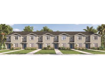A new construction townhouse complex featuring a neatly manicured lawn and modern design at 300 Preston Cove Dr, St Cloud, FL 34771