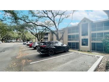 Exterior view of building showing parked cars and exterior architectural details at 629 Dory Ln # 202, Altamonte Springs, FL 32714