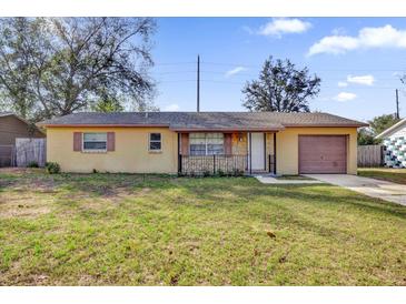 Charming single-story home featuring a front lawn and an attached one car garage at 1866 Matterhorn Dr, Orlando, FL 32818