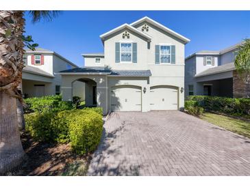 Charming two-story home featuring a two-car garage and a well-manicured front yard at 3270 Mt Vernon Way, Kissimmee, FL 34741