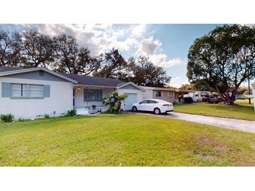 Charming single-story home with a well-maintained lawn and inviting curb appeal at 3520 Arch St, Orlando, FL 32808