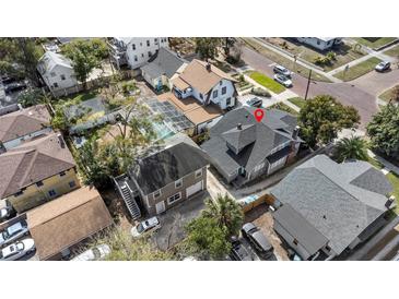 Charming home with a pool and lush greenery in a desirable neighborhood setting at 627 N Hyer Ave, Orlando, FL 32803
