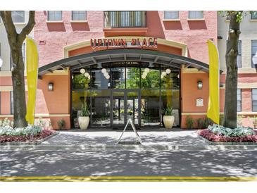 Stunning entrance to Uptown Place with lush landscaping and a welcoming, modern design at 911 N Orange Ave # 148, Orlando, FL 32801