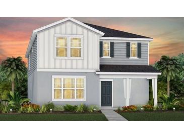 Charming two-story home with a combination of white and gray siding and a well-manicured lawn at 7054 Rosy Sky Ave, Orlando, FL 32829