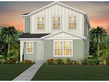 Inviting two-story home featuring a blend of vertical siding and stucco with lush landscaping and a welcoming walkway at 7150 Rosy Sky Ave, Orlando, FL 32829