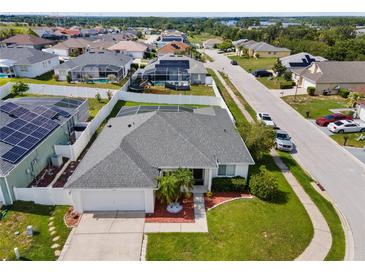 Beautiful single-story home featuring a well-manicured lawn and a two car garage in a desirable neighborhood at 133 Hillcrest Dr, Davenport, FL 33897