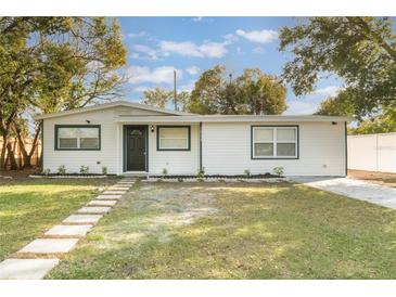 Charming single-story home with a well-manicured lawn and inviting front entrance at 10526 Fernando St, Orlando, FL 32825