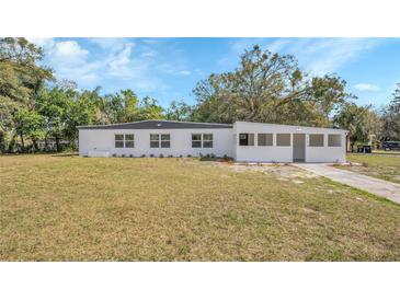 Charming single-story home with a well-maintained lawn and modern exterior paint, perfect for curb appeal at 5108 Balboa Dr, Orlando, FL 32808