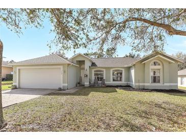 Charming single-story home with a well-maintained lawn and inviting facade at 154 Desiree Aurora St, Winter Garden, FL 34787