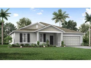 Charming single-story home with a well-manicured lawn and an attached two-car garage at 2293 Pecos Ct, Kissimmee, FL 34759