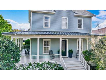 Inviting front porch with rocking chairs, providing a relaxing outdoor space at 4184 Oak St, Orlando, FL 32814