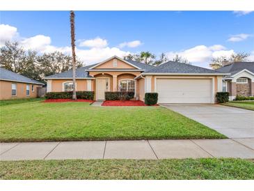 Charming single-story home with a well-manicured lawn and inviting curb appeal at 330 Hickory Springs Ct, Debary, FL 32713