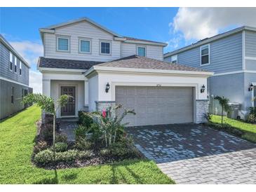 Beautiful two-story home with a well-manicured lawn and charming curb appeal at 3751 Lana Ave, Davenport, FL 33897