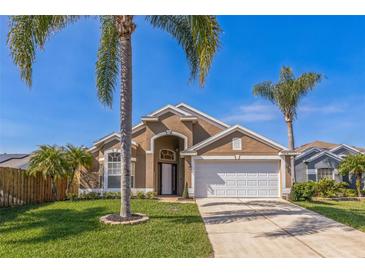Charming one-story home with a two-car garage, and manicured lawn at 3814 Aiden Pl, Apopka, FL 32703