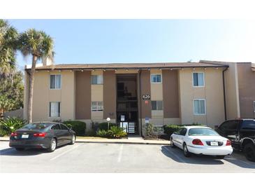 A charming, multi-story condo building with designated parking and lush landscaping at 626 Orange Dr # 242, Altamonte Springs, FL 32701