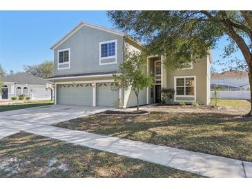 Charming two-story home featuring a two-car garage and a well-maintained front yard at 1368 Falconwood Ct, Apopka, FL 32712