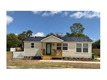 Charming single-story home with a cozy front porch, white picket fence, and well-maintained landscaping at 630 3Rd Street St, Oviedo, FL 32765