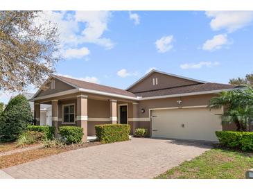 Beautiful single-story home with a well-manicured lawn and inviting covered front porch at 11619 Chateaubriand Ave, Orlando, FL 32836