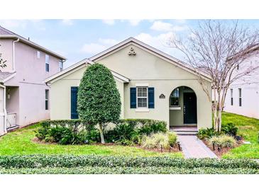 Charming single-story home with a well-manicured front yard and lush landscaping at 15506 Tidal Cove Aly, Winter Garden, FL 34787