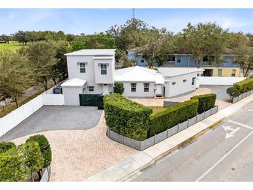 Contemporary home with a manicured yard and a stylish driveway providing ample parking at 726 N Pennsylvania Ave, Winter Park, FL 32789
