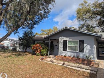 Charming single-story home featuring neutral paint, complimented by mature trees and a well-manicured front yard at 103 Brown Dr, Sanford, FL 32773