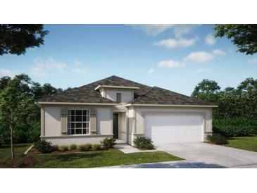 Inviting single-story home with neutral colors, well-manicured landscaping, and a two-car garage at 6634 Rhythm Dr, Mascotte, FL 34753