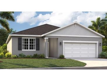 Charming single-story home featuring a two-car garage, well-maintained lawn, and traditional architectural details at 1132 Clay Blvd, Tavares, FL 32778