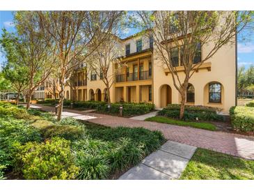 Charming townhouses with lush landscaping, brick pathways, and inviting curb appeal at 1859 Britlyn Aly, Orlando, FL 32814
