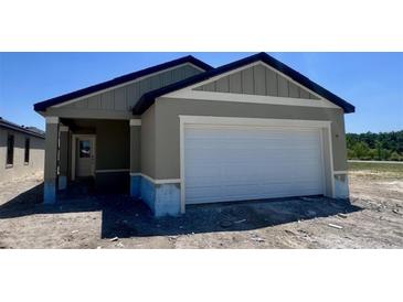 Charming single-story home featuring a two-car garage and neutral color palette at 3219 Cup Dr, Lakeland, FL 33803