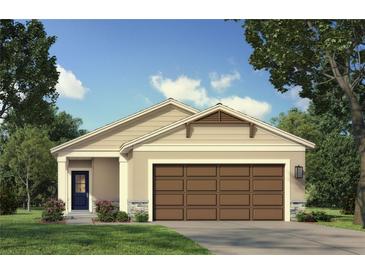 Charming single-story home with neutral tones, stone accents, a brown garage door, and a well-manicured lawn at 3352 Cup Dr, Lakeland, FL 33803