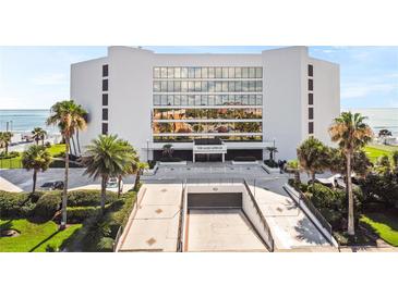 Modern condo building featuring covered parking and beach access at 901 S Atlantic Ave # 5, Ormond Beach, FL 32176