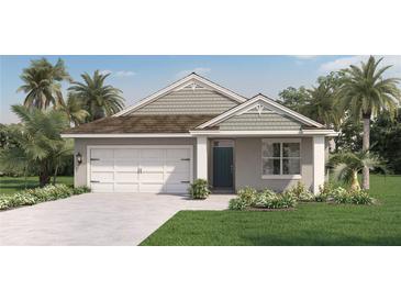 Charming one-story home featuring a two-car garage and a well-manicured lawn with lush landscaping at 7077 Painted Bunting Way, St Cloud, FL 34773