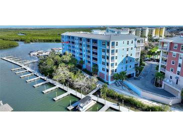 Waterfront condo building with private boat docks offers luxurious coastal living and scenic views at 3 Riverwalk Dr # 506, New Smyrna Beach, FL 32169